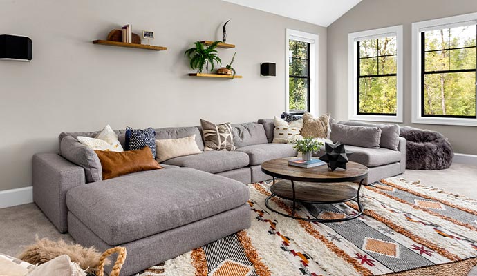 A spacious living room featuring a large sectional sofa