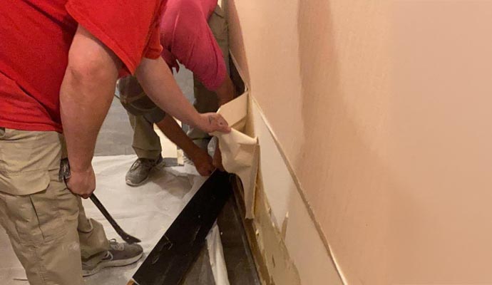 Service providers restoring damaged drywall