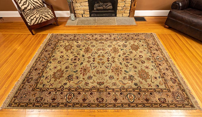 Clean oriental area rug on hardwood floor