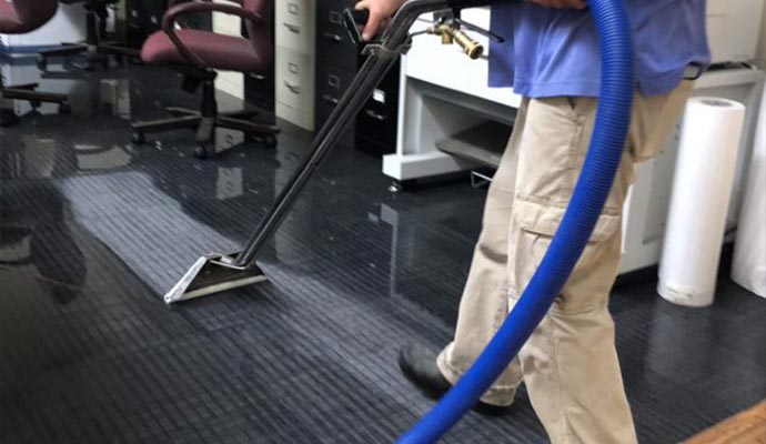 cleaning carpet with equipment