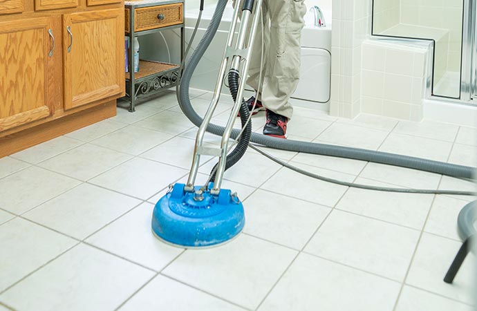 Worker cleaning the floor professionally.