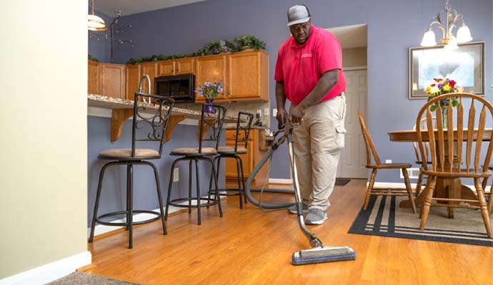 Technician Deep Cleaning Wood Floors