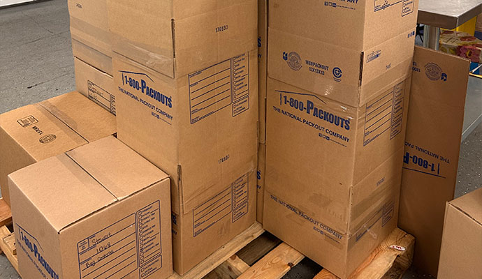 Stacked cardboard boxes on wooden pallets for packing and storage