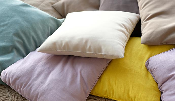Stack of different color throw pillows